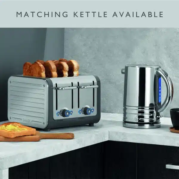 Dualit DA4526 4 Slot Architect Toaster with toast, next to a matching kettle, on a kitchen counter.