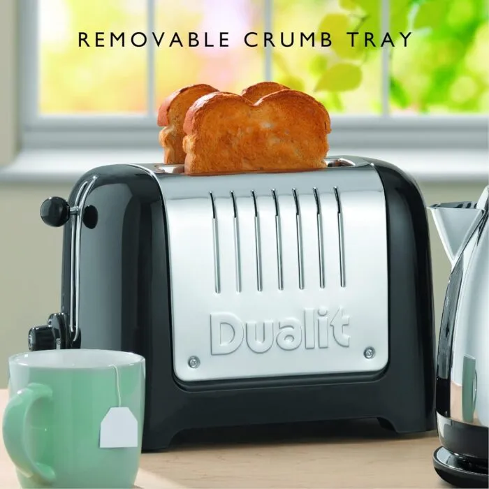 Dualit Da2625 2 slice Lite Toaster in High Gloss Black with Toast Next to a Mug on a Kitchen Counter