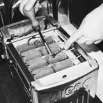 Hands Repairing the Interior Mechanism of a Dualit Da0144 6 Slice Vario Toaster